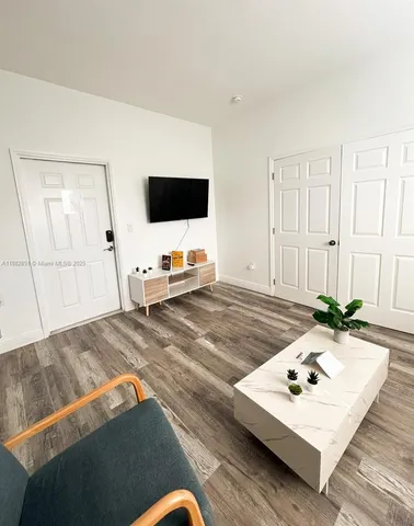 a living room with a couch and a flat screen tv