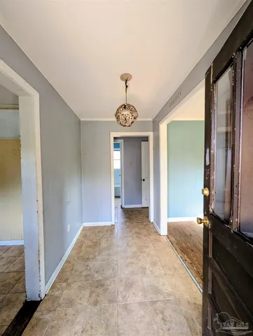 a view of a hallway with a chandelier