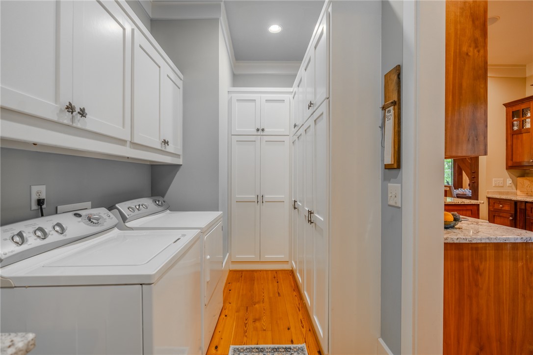102 State Rd S-39-143 Sunset, SC 29685 - Photo 23 of 47 This dedicated laundry space offers practical storage and efficient organization for everyday tasks.