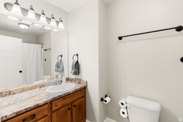 2485 South 1100th Street West Logan, UT 84321 - Photo 24 of 53 Bathroom vanity with a light wood-finish cabinet and a patterned countertop