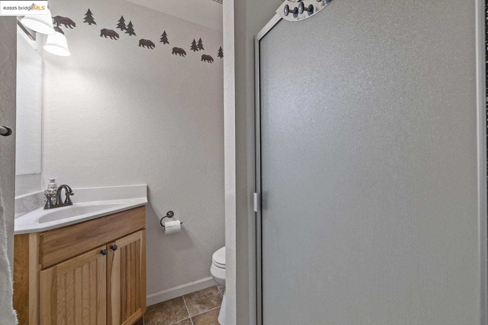 33781 Upper Leland Road, Unit A Pinecrest, CA 95364 - Photo 15 of 33 a bathroom with a granite countertop sink toilet and a mirror