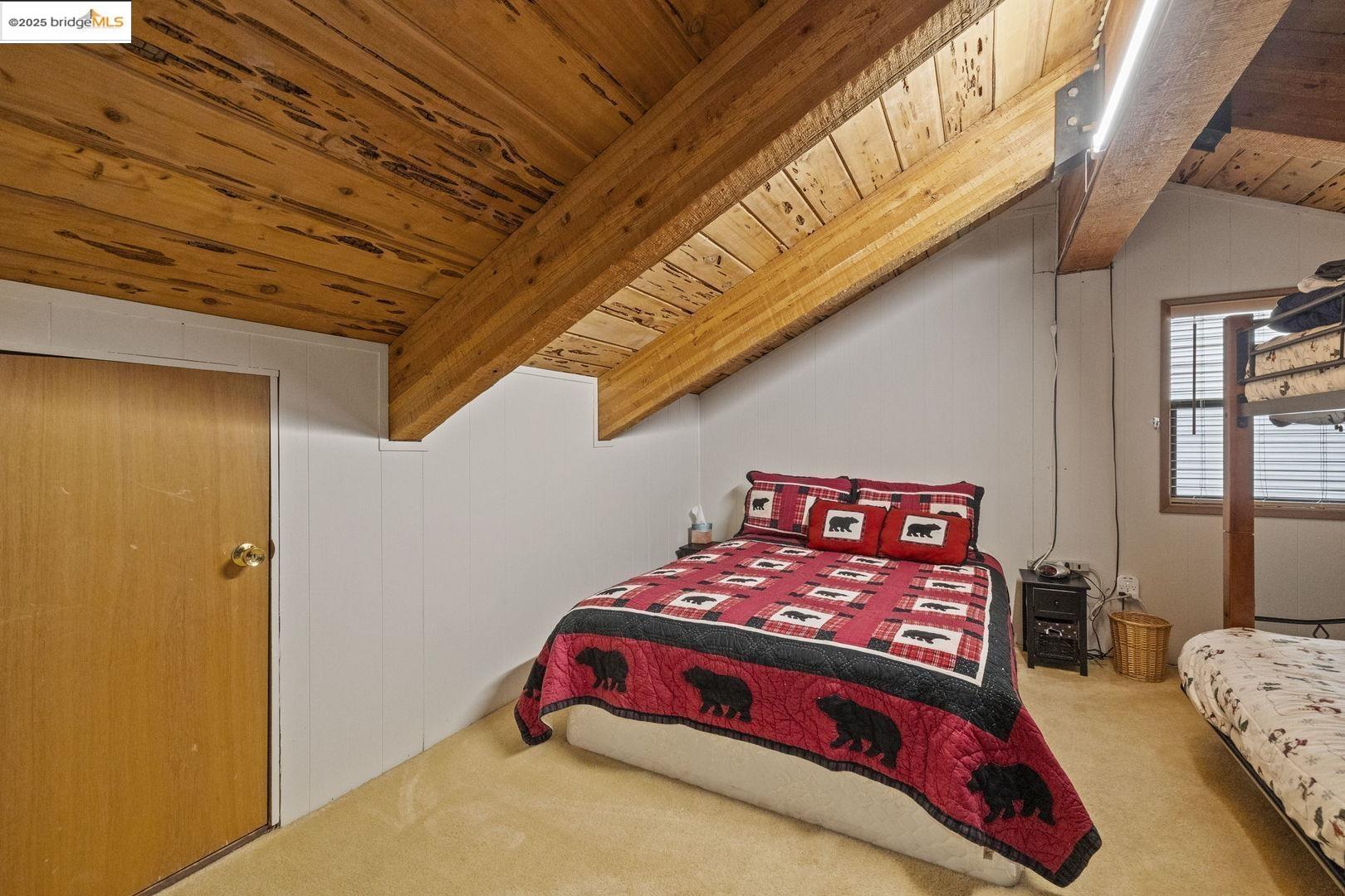 33781 Upper Leland Road, Unit A Pinecrest, CA 95364 - Photo 17 of 33 a bedroom with a bed next to a window