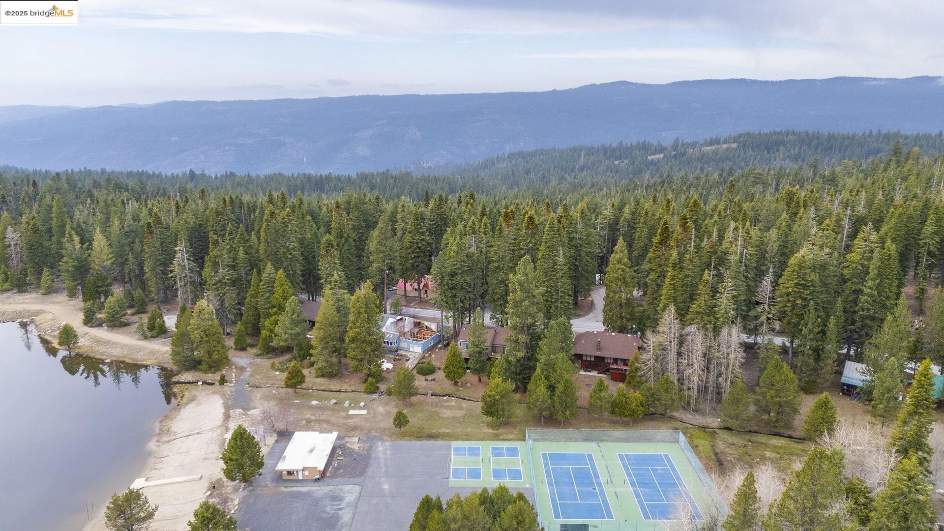 33781 Upper Leland Road, Unit A Pinecrest, CA 95364 - Photo 29 of 33 a view of a city with lots of residential buildings mountain and mountain view in back