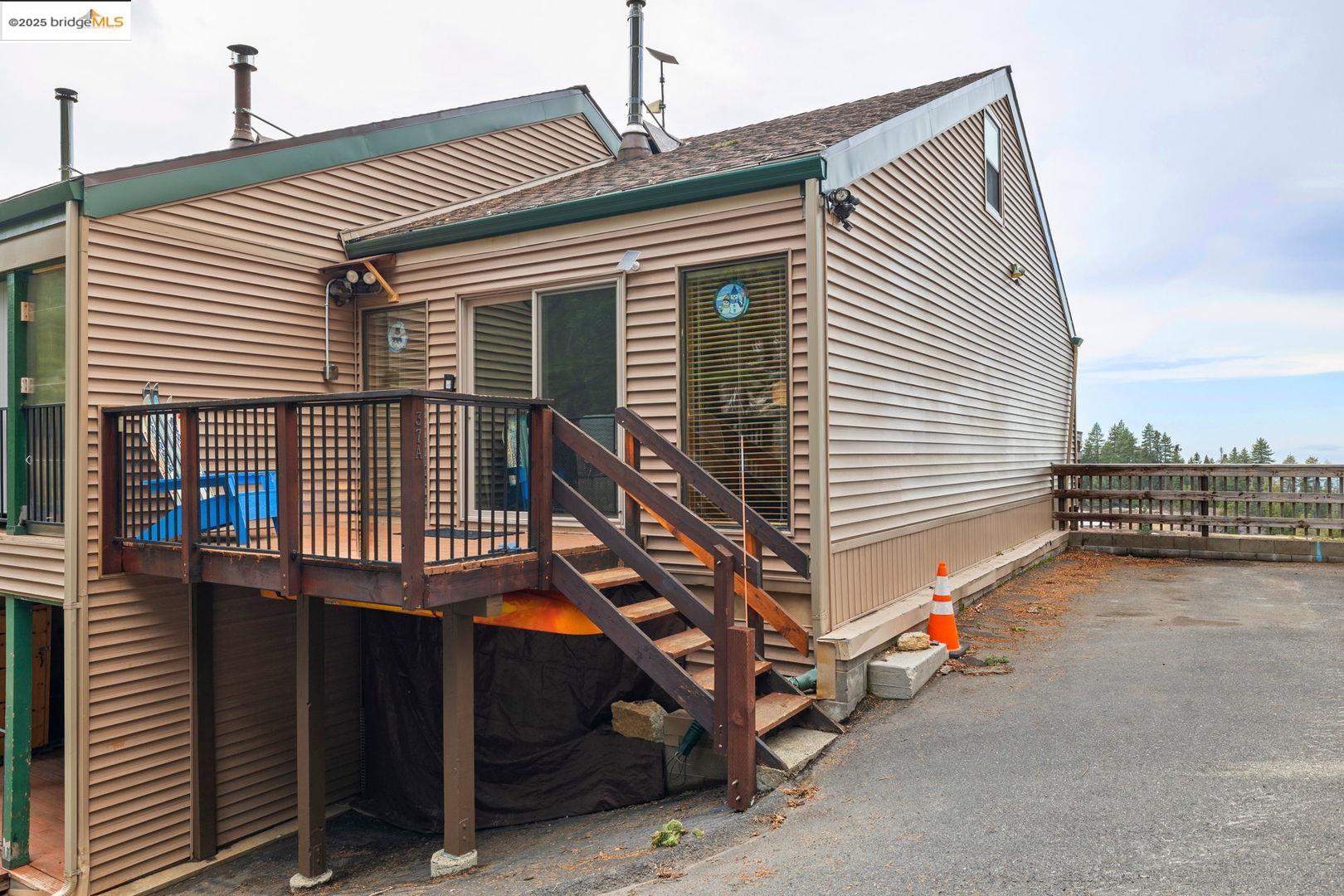 33781 Upper Leland Road, Unit A Pinecrest, CA 95364 - Photo 33 of 33 a yellow house with wooden fence