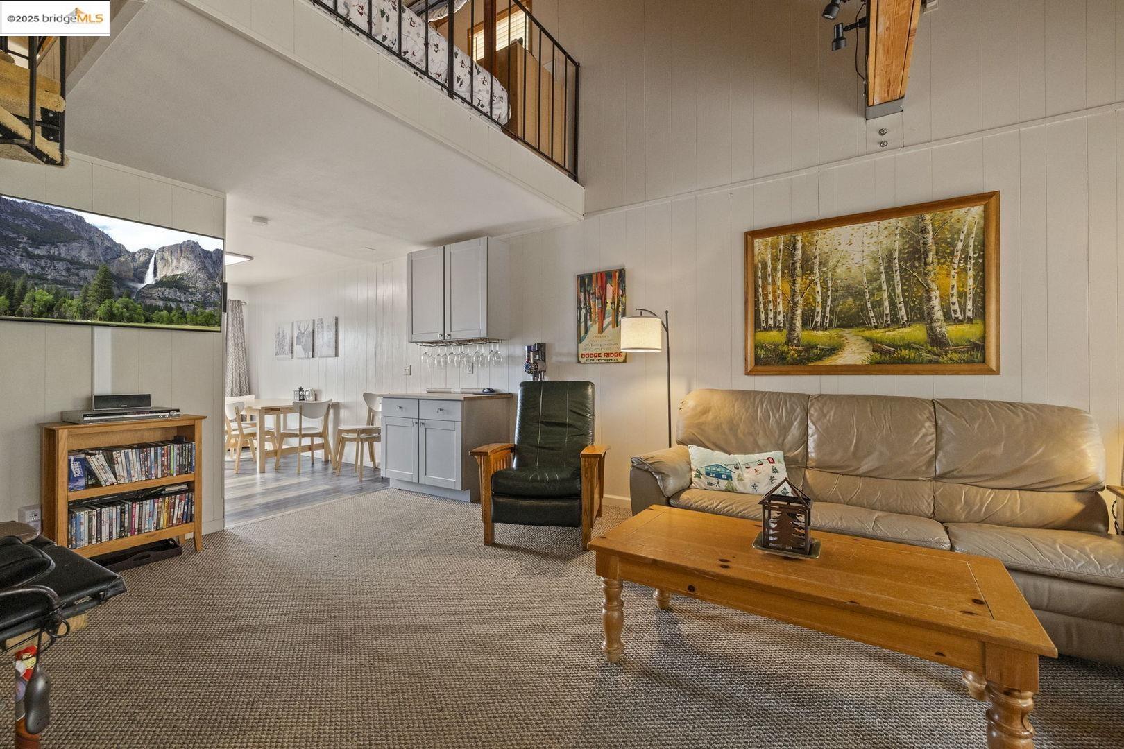 33781 Upper Leland Road, Unit A Pinecrest, CA 95364 - Photo 5 of 33 a living room with furniture and a flat screen tv