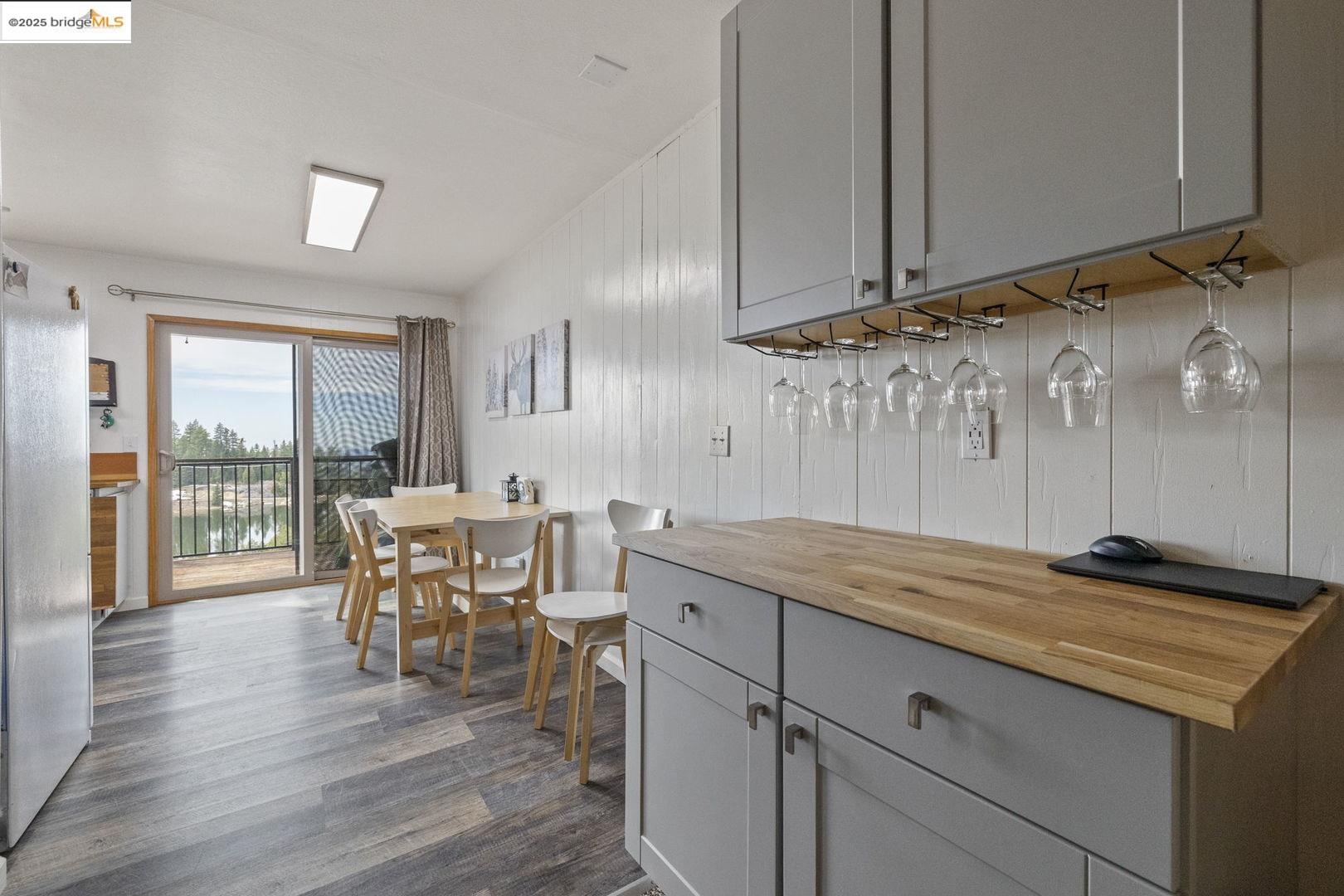33781 Upper Leland Road, Unit A Pinecrest, CA 95364 - Photo 7 of 33 a view of a dining room with furniture and wooden floor