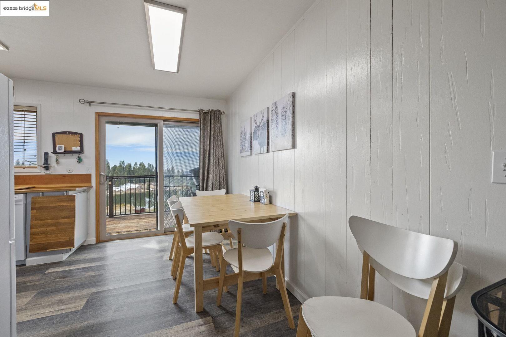 33781 Upper Leland Road, Unit A Pinecrest, CA 95364 - Photo 8 of 33 a dining room with furniture a chandelier and wooden floor