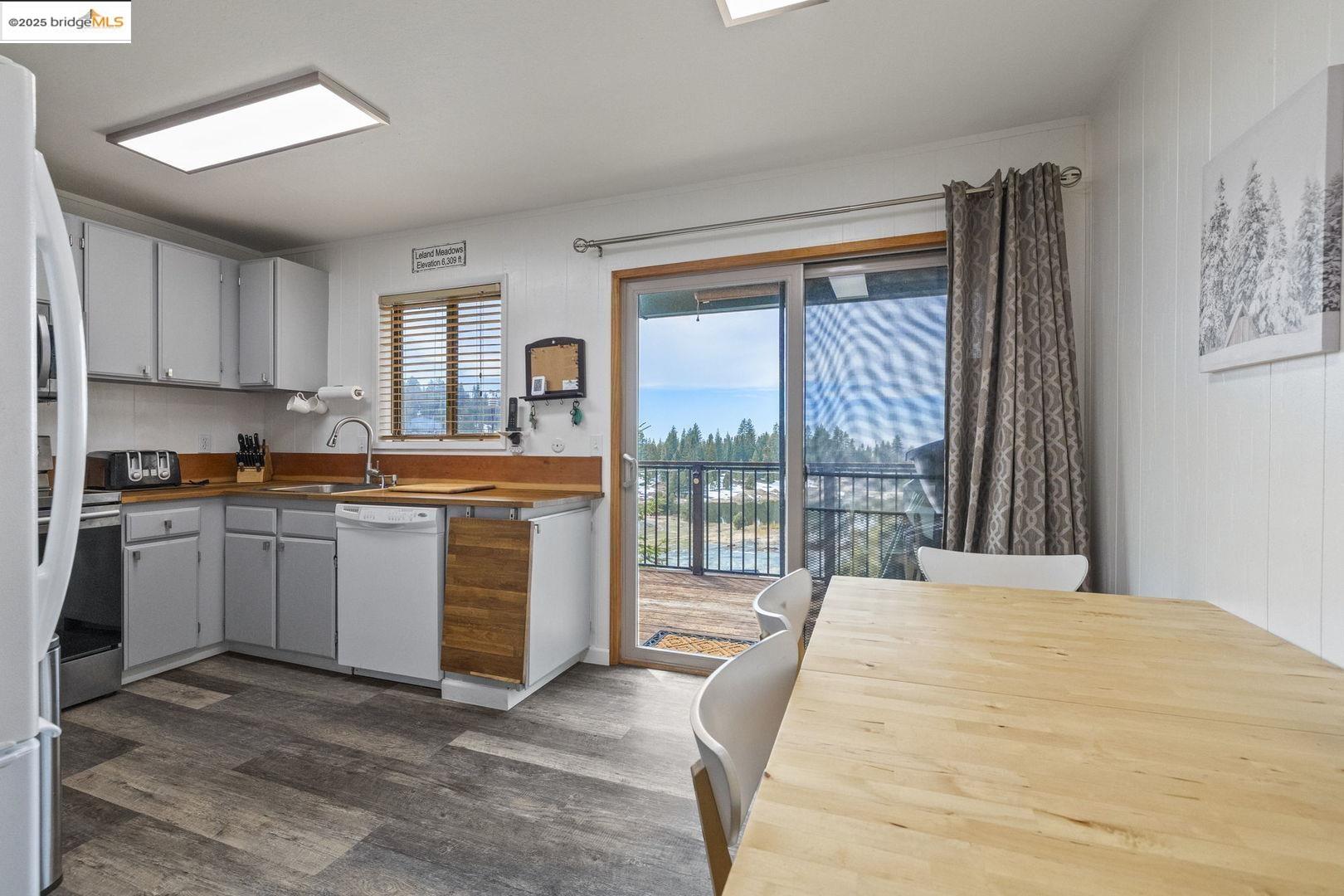 33781 Upper Leland Road, Unit A Pinecrest, CA 95364 - Photo 9 of 33 a kitchen with a large window and a sink