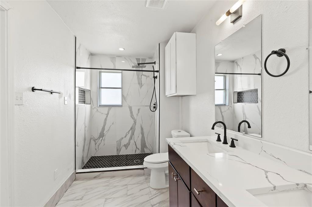 1012 East Dallas Street Mansfield, TX 76063 - Photo 15 of 25 a bathroom with a sink a toilet and shower
