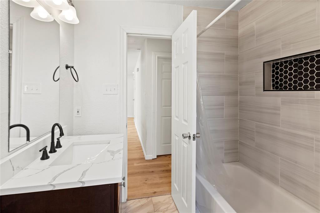 1012 East Dallas Street Mansfield, TX 76063 - Photo 22 of 25 a bathroom with a sink and a bathtub