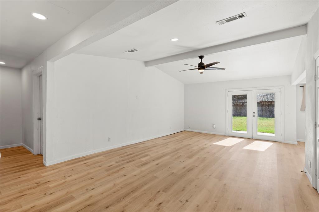 1012 East Dallas Street Mansfield, TX 76063 - Photo 5 of 25 wooden floor in an empty room with a window