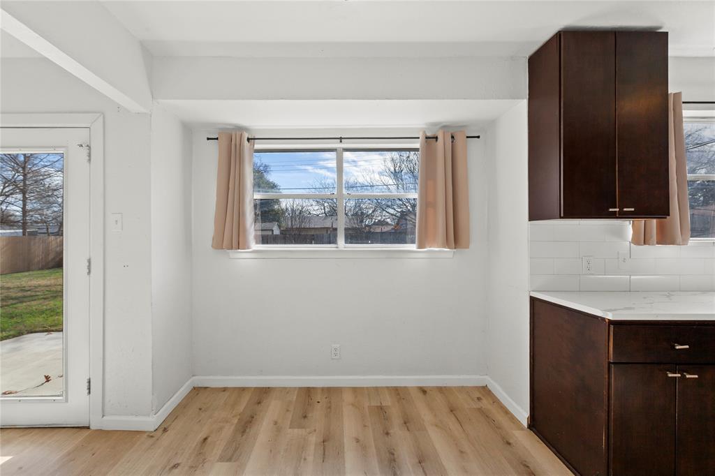 1012 East Dallas Street Mansfield, TX 76063 - Photo 9 of 25 a view of empty room with wooden floor and fan