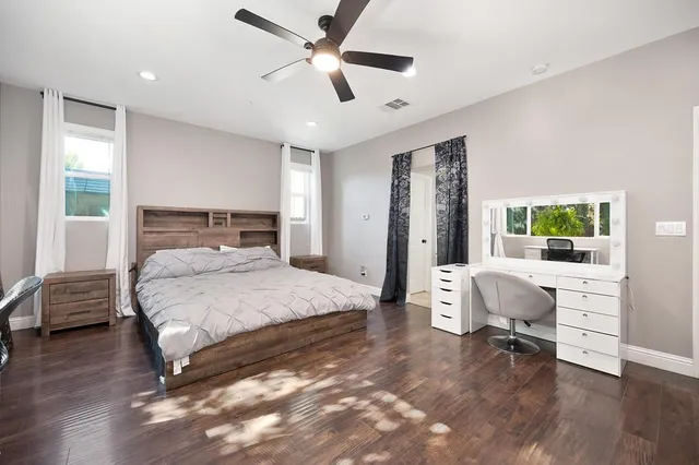 a bedroom with a bed and a chair