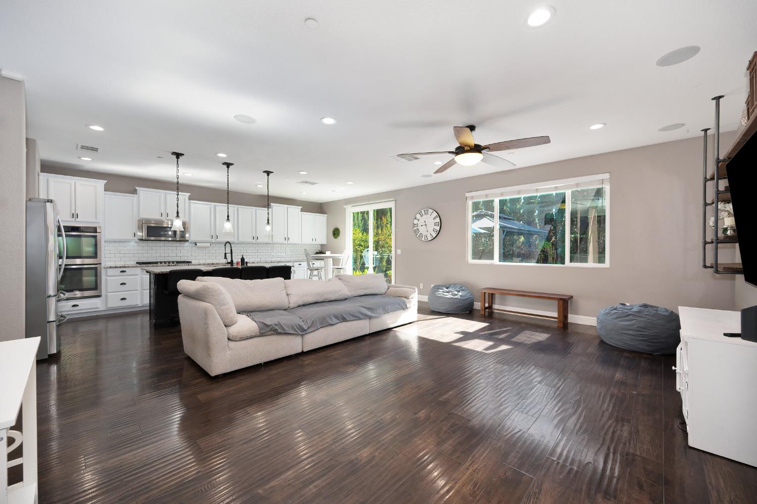 806 Mono Street Manteca, CA 95337 - Photo 13 of 38 a living room with stainless steel appliances kitchen island furniture and a wooden floor