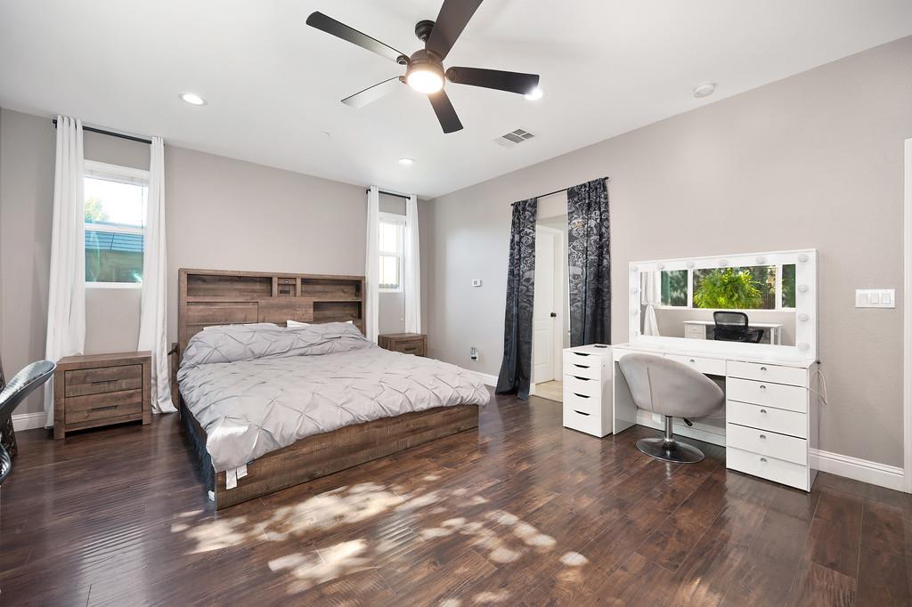 806 Mono Street Manteca, CA 95337 - Photo 15 of 38 a bedroom with a bed and a chair