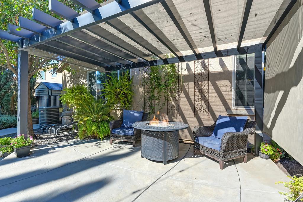 806 Mono Street Manteca, CA 95337 - Photo 33 of 38 a building outdoor space with patio furniture and potted plants