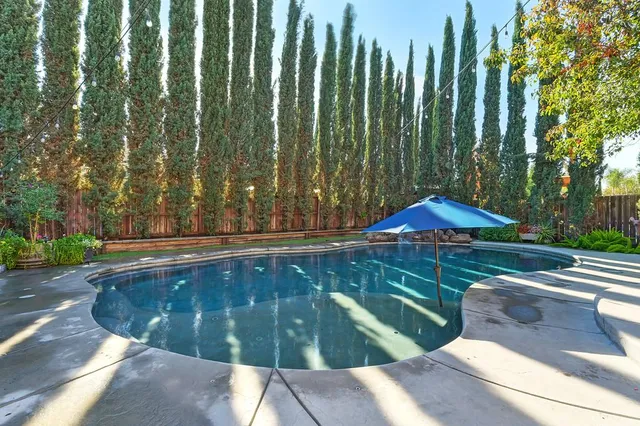 a building outdoor space with patio furniture and potted plants
