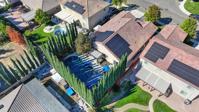 an aerial view of residential houses with outdoor space
