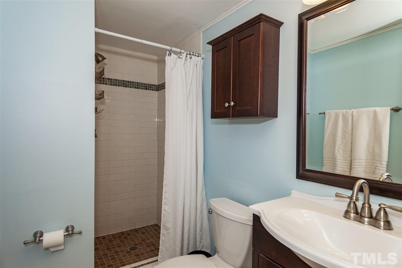 7709 Nugget Lane Raleigh, NC 27615 - Photo 22 of 25 a bathroom with a sink toilet and shower