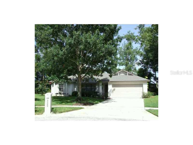 2220 Mapleton Court Winter Park, FL 32792 - Photo 1 of 1 a view of a white house with a small yard and potted plants