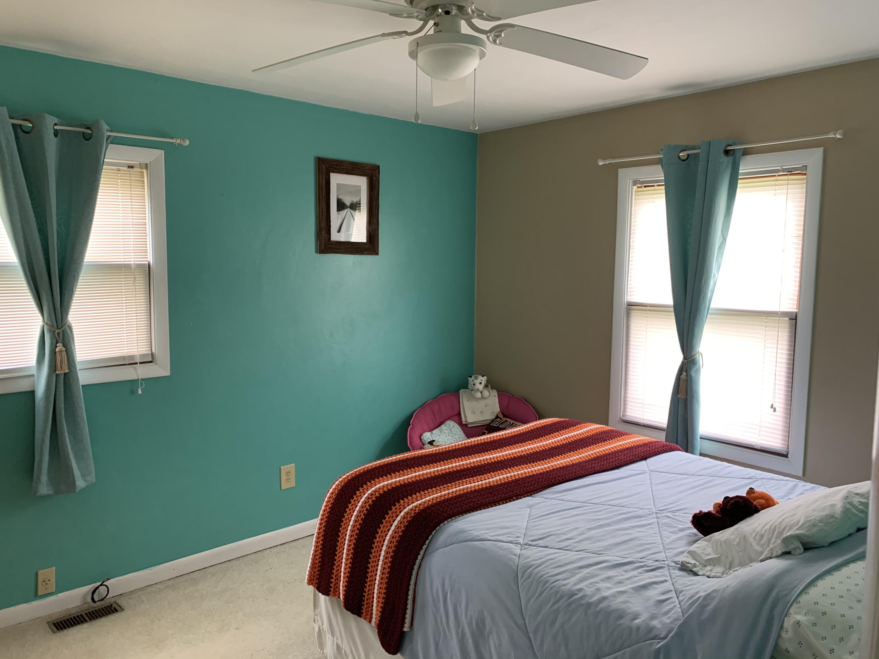 691 Mountain Pass Road Blue Ridge, VA 24064 - Photo 4 of 13 a bedroom with a bed and a window