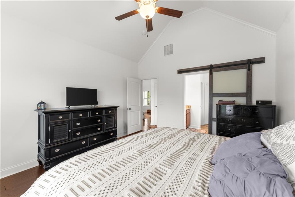 10 Coppage Lane Cartersville, GA 30120 - Photo 22 of 51 a bedroom with a bed and a flat tv screen