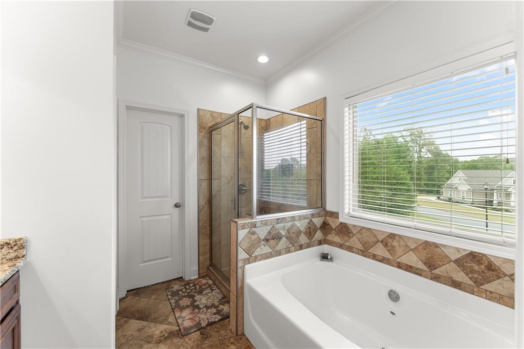 10 Coppage Lane Cartersville, GA 30120 - Photo 24 of 51 a bathroom with a bathtub and a shower