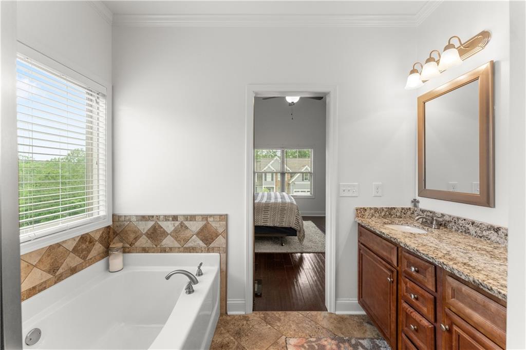 10 Coppage Lane Cartersville, GA 30120 - Photo 25 of 51 a en suite bathroom with a granite countertop tub and a sink