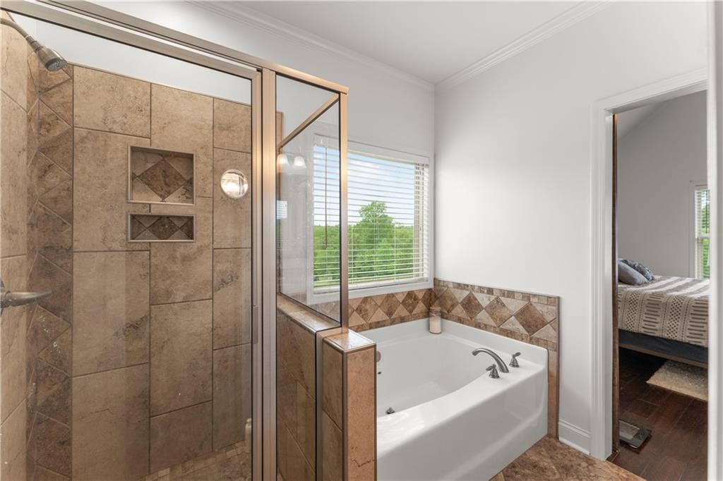 10 Coppage Lane Cartersville, GA 30120 - Photo 26 of 51 a bathroom with a tub a sink and a window