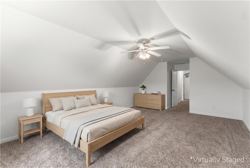 10 Coppage Lane Cartersville, GA 30120 - Photo 37 of 51 a spacious bedroom with a bed and a chandelier