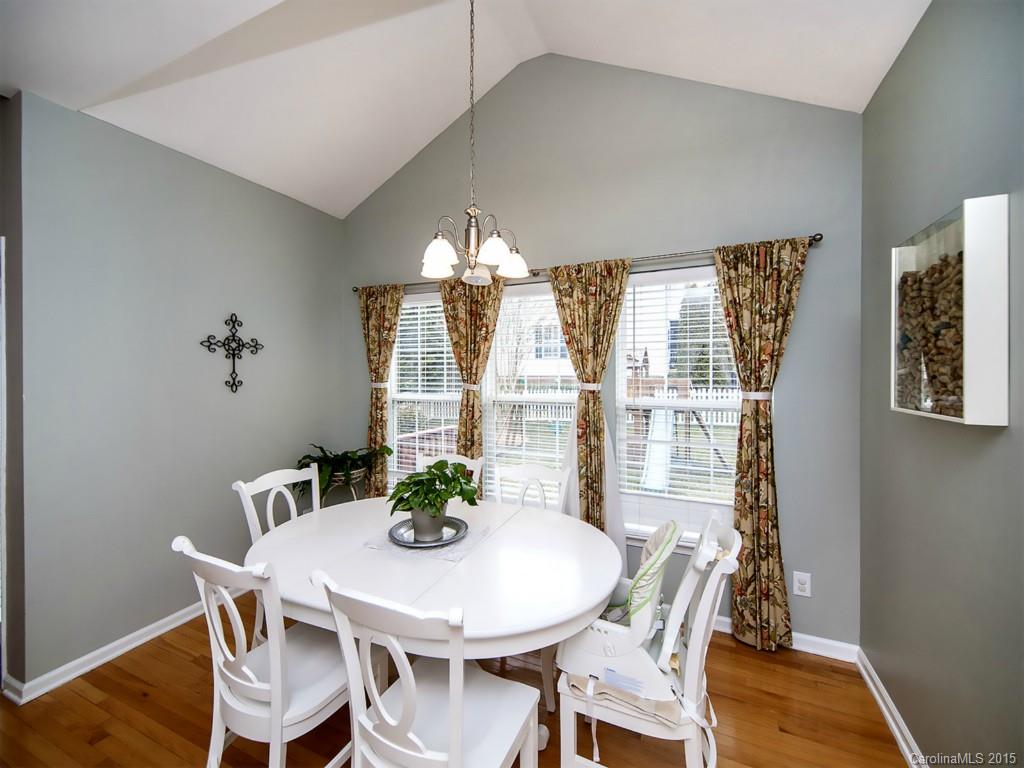 6509 Elfreda Road Charlotte, NC 28270 - Photo 8 of 19 a view of a dining room with furniture window and wooden floor