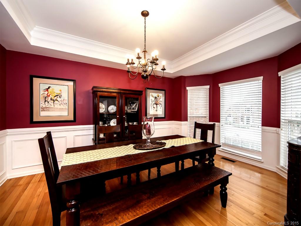 6509 Elfreda Road Charlotte, NC 28270 - Photo 10 of 19 a view of a dining room with furniture window and wooden floor