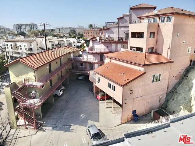 a buildings covered with tall trees