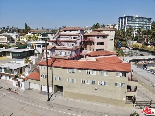 a buildings covered with tall trees