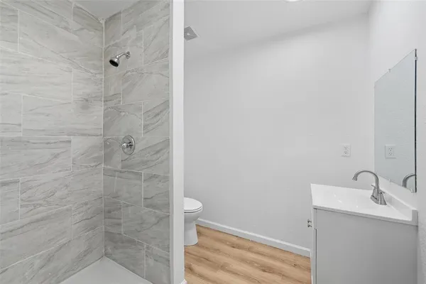 a bathroom with a sink and shower