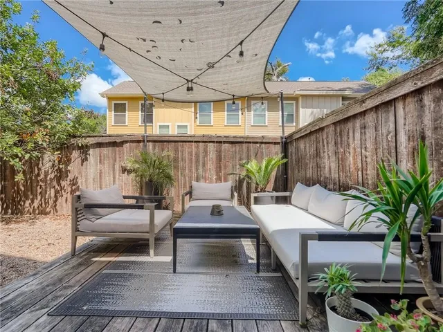 a outdoor space with patio the couches and a dining table with chairs