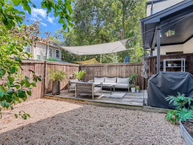 a view of a patio with a table and chairs