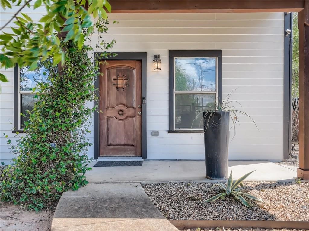 3304 East 5th Street, Unit A Austin, TX 78702 - Photo 2 of 16 a front view of a house with garden