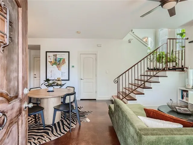 a living room with furniture and a table