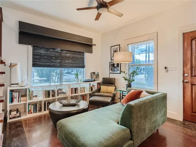 a living room with furniture and a window