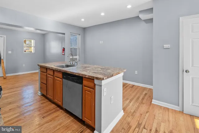 a view of kitchen island wooden floor