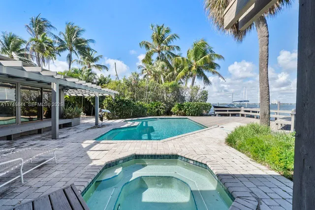 a view of a swimming pool with a patio
