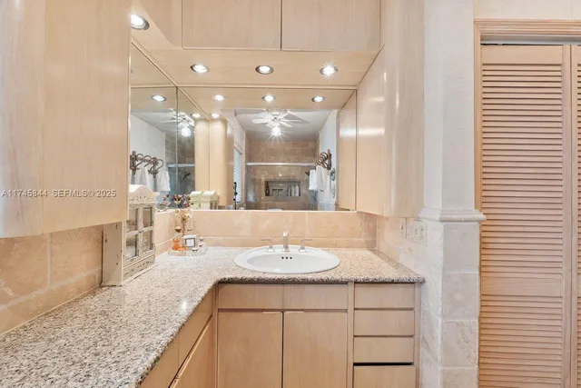 a bathroom with a sink double vanity and a mirror