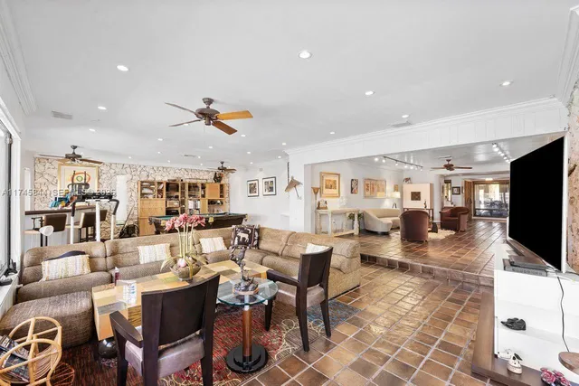 a living room with fireplace furniture and a flat screen tv