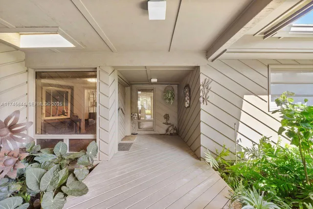 a view of a porch with seating space