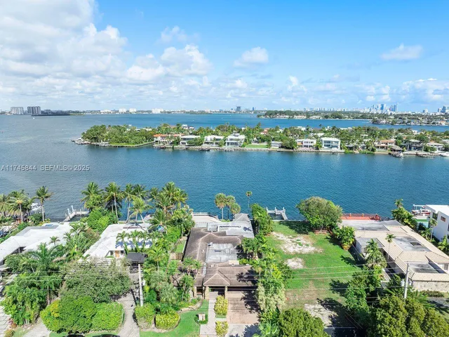 an aerial view of a houses with outdoor space