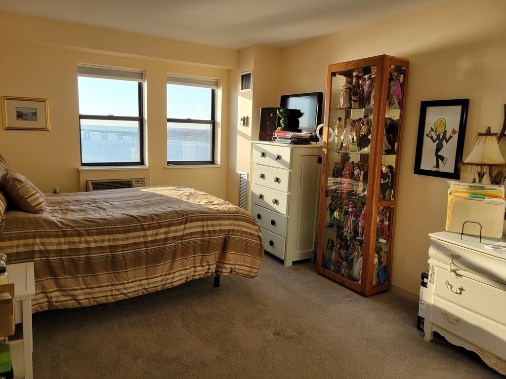 750 Davol Street, Unit 1012 Fall River, MA 02720 - Photo 11 of 29 a bedroom with a bed and a window