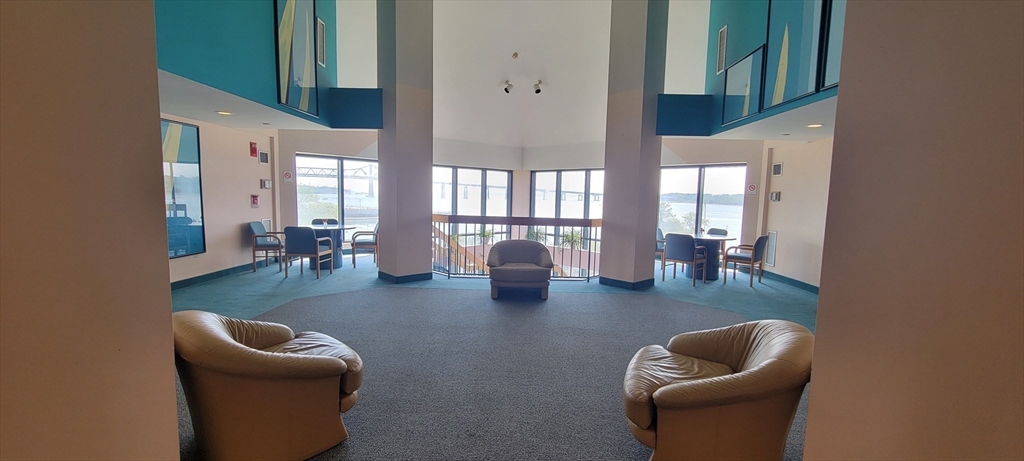 750 Davol Street, Unit 1012 Fall River, MA 02720 - Photo 16 of 29 a living room with furniture and a potted plant