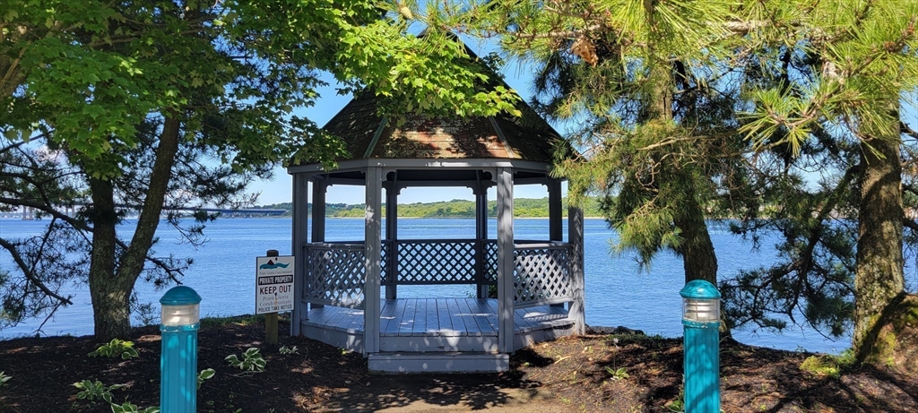 750 Davol Street, Unit 1012 Fall River, MA 02720 - Photo 25 of 29 a front view of a house with garden