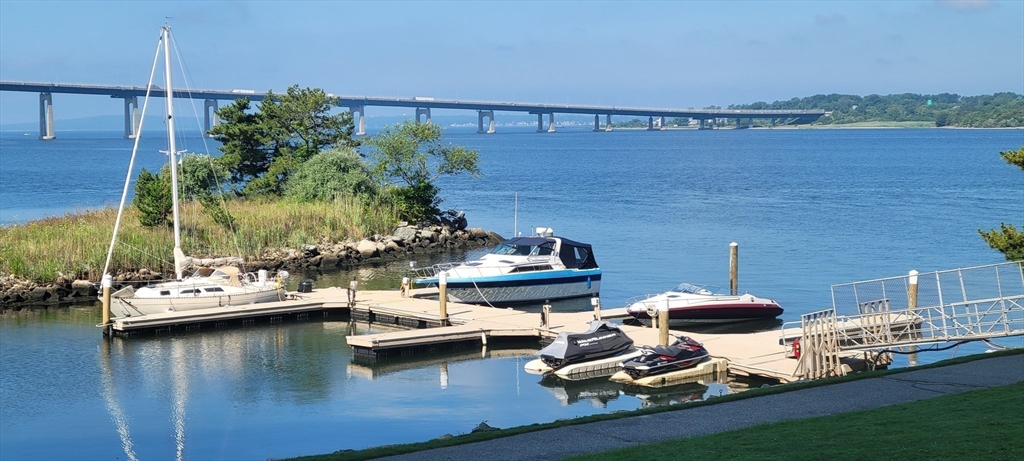 750 Davol Street, Unit 1012 Fall River, MA 02720 - Photo 28 of 29 a view of a lake with chairs
